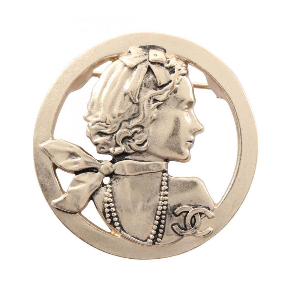 CHANEL Gold Logo Brooch